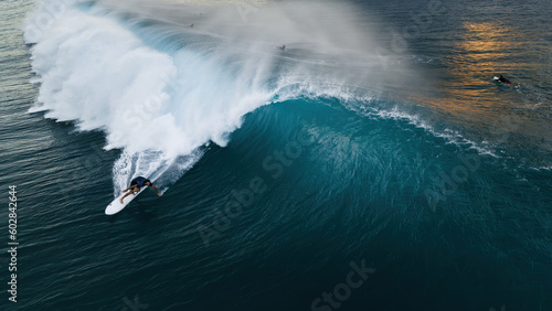 Surfer on a wave in hawaii  photo