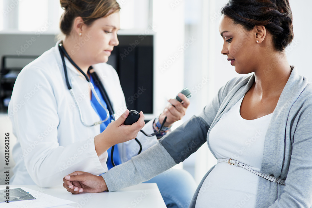 Blood pressure, healthcare and doctor with a pregnant woman for a consultation of health. Hospital, wellness check and a medical worker with a patient consulting about hypertension during pregnancy - obrazy, fototapety, plakaty 