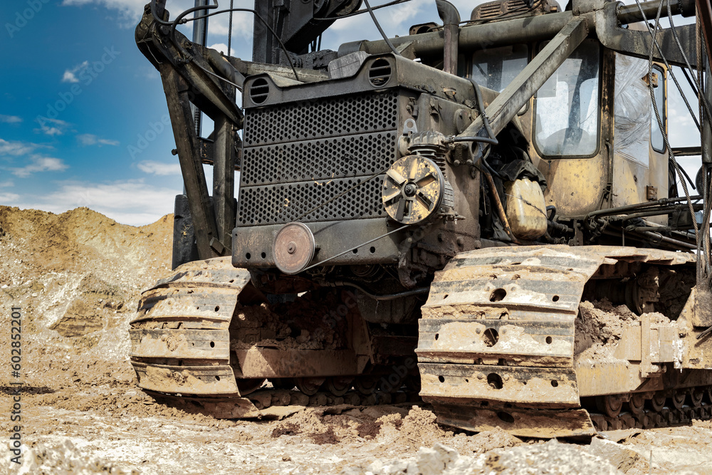 Pile driving machine. Diesel hammer pile driving machine working on construction site. Preparation of the pile foundation for the construction of the building. Close-up.