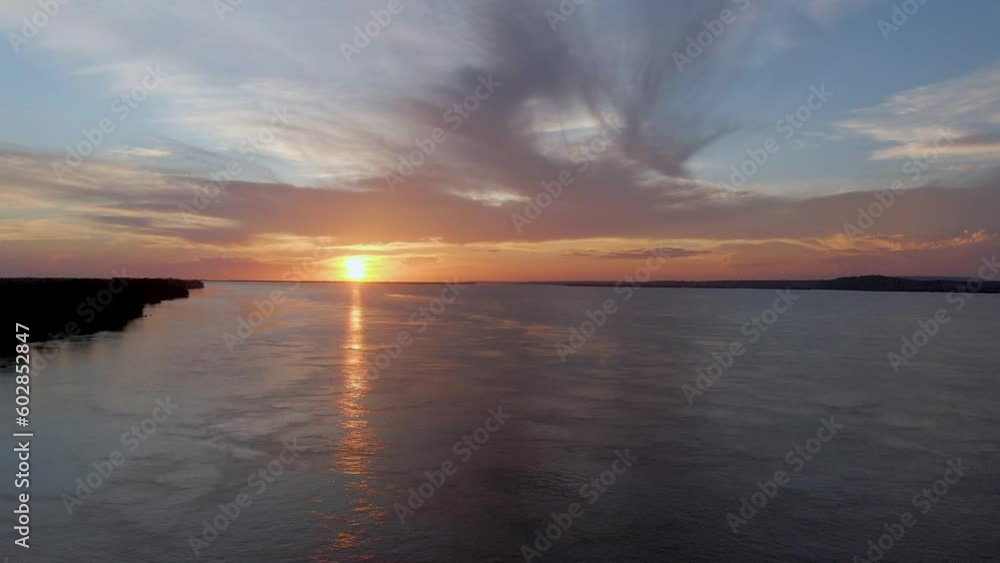 Aerial view of the sunset reflecting from the surface of the Amazon river, in Brazil Aerial view of the sunset reflecting from the surface of the Amazon river, in Brazil