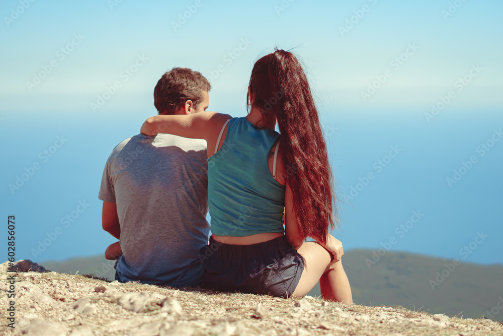 the couple is sitting on top the couple is sitting on top