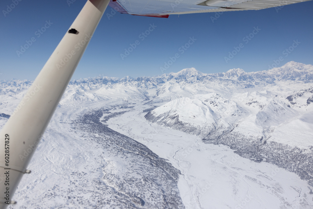 Fototapeta premium Glacier from airplane window over Mountain Denali