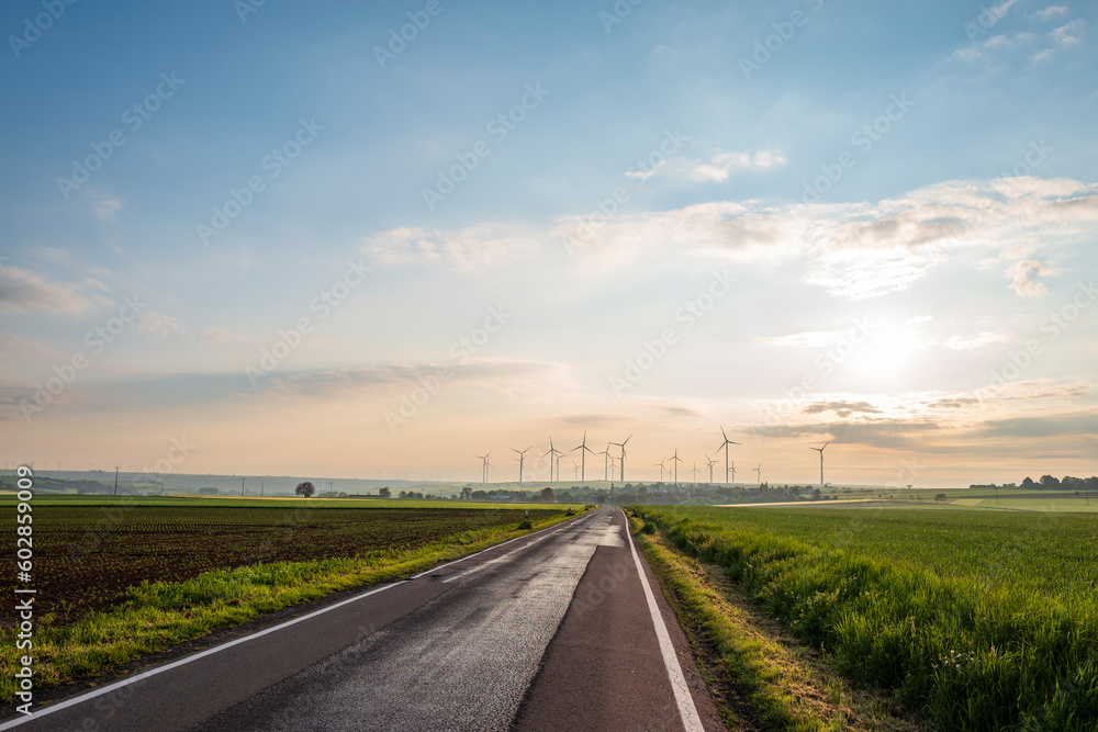 road in the countryside with wind turbines