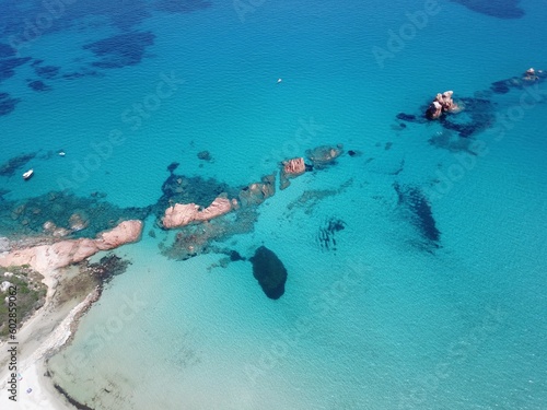 Aerial view of red rocks against blue Mediterranean Sea