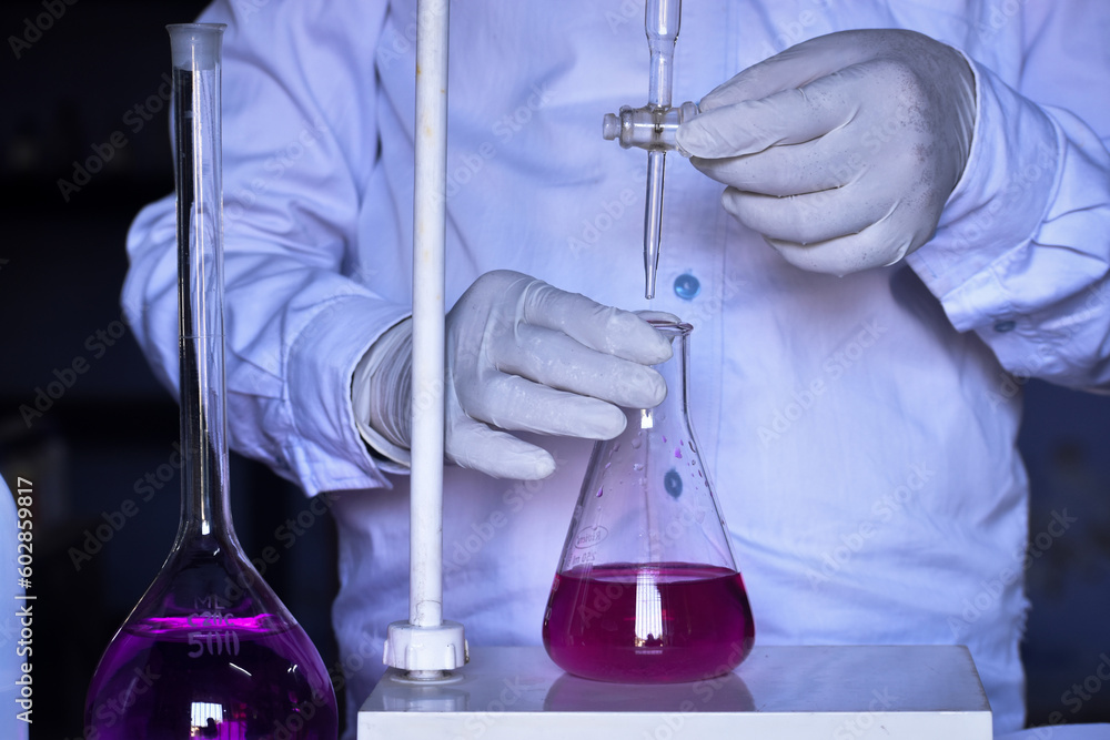 The chemist conducts acid-base titration and adding solutions Stock ...