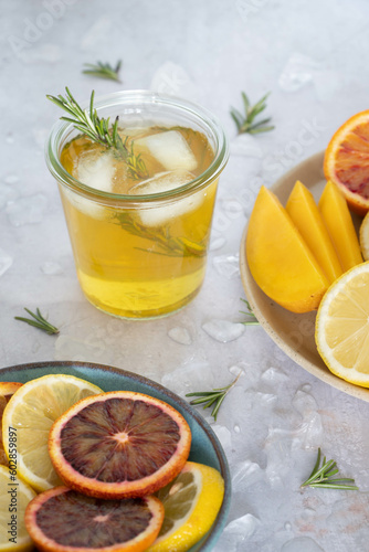 A glass of iced tea with fresh fruit photo