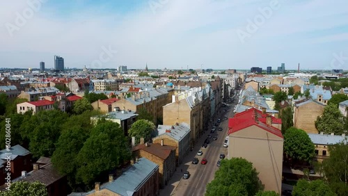 Riga Cityscape Spring Aerial Top View Video, Town, Latvia. Sunny Day Building Rooftops. Riga Skyline, Latvia, City Center, Teika, Purvciems in the Background. Architecture of the Downtown. photo