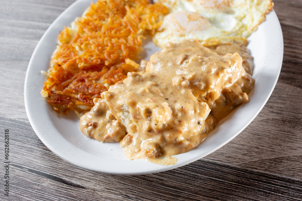 A view of biscuits and gravy breakfast plate. A view of biscuits and gravy breakfast plate.