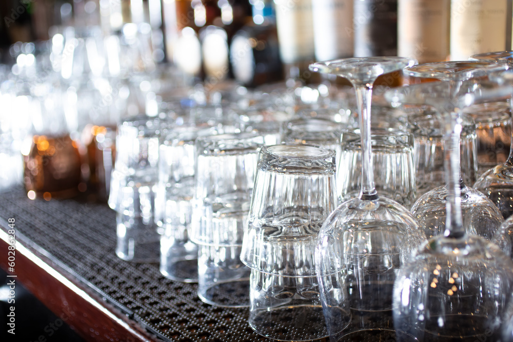 A view of a counter full of clean cocktail glasses. A view of a counter full of clean cocktail glasses.