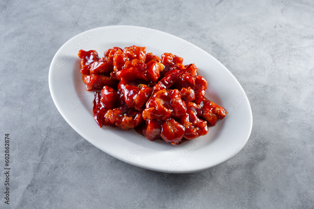 A view of a plate of orange chicken. A view of a plate of orange chicken.