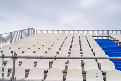 detail of the blue and white plastic seats of the bleachers installed in an esplanade of a public parking lot for an open air concert. Puerto de la Cruz, Tenerife, Canary Islands, Spain