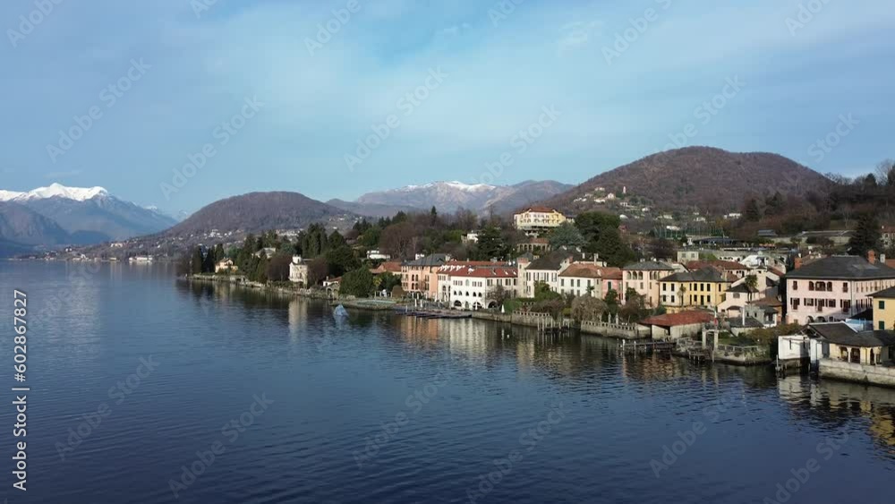 Picturesque village on Lake Orta shores, Italy. Aerial backward ascending and sky for copy space Picturesque village on Lake Orta shores, Italy. Aerial backward ascending and sky for copy space