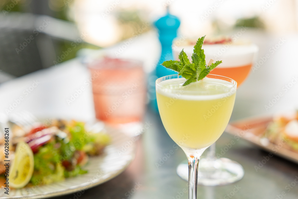 Different delicious summer cocktails on grey table in bar Different delicious summer cocktails on grey table in bar