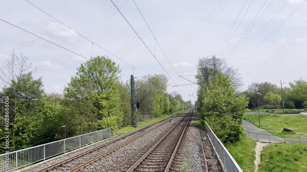 empty green railway line in germany in good weather empty green railway line in germany in good weather