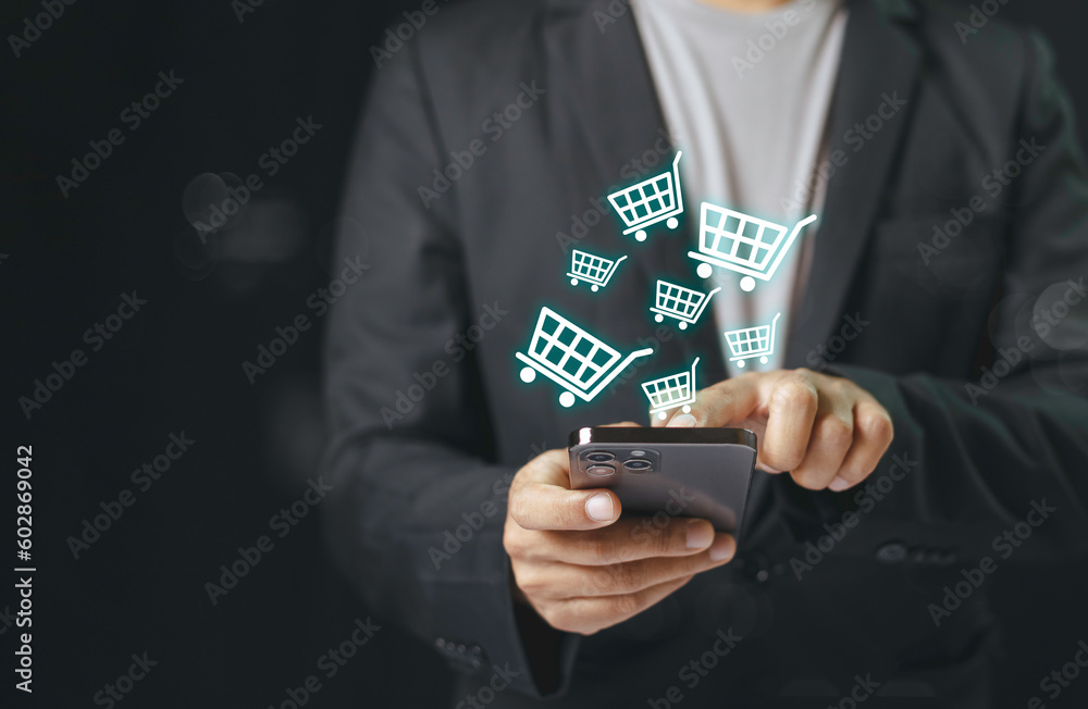 Businessman using smartphone shopping online, shopping cart icon on screen mobile phone. purchase payment on internet. online supermarket gadget. - obrazy, fototapety, plakaty 