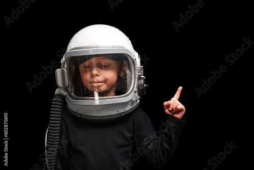 child wants to fly an airplane wearing an airplane helmet © vovan
