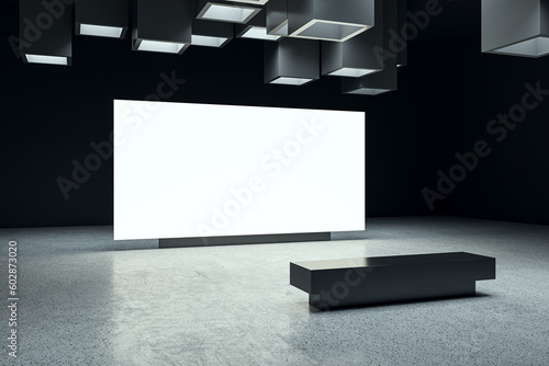 Tableau sur toile Perspective view on white blank digital screen with space for advertising or campaign in abstract dark exhibition hall interior with concrete floor on background