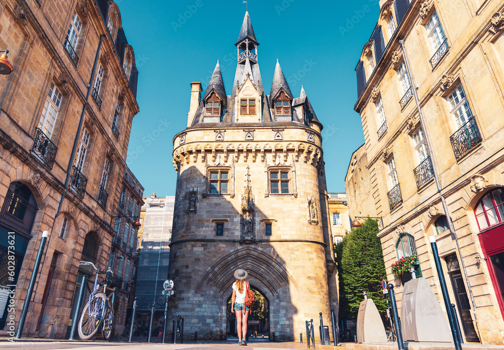 Bordeaux city,  Porte Cailhau and woman tourist,  tourism in France, Nouvelle aquitaine