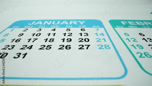 February 2023. March 2023. Macro shot with many dater. Holidays. A retro flip calendar showing every day of 2023 up until January 1st 2024.