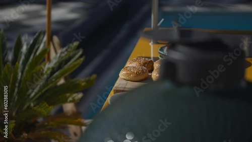 Side portrait shot of a café table with sum buns  photo