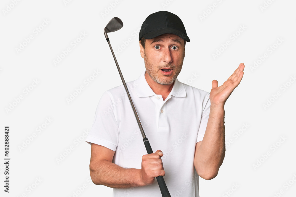 Middle aged golfer man surprised and shocked. Middle aged golfer man surprised and shocked.