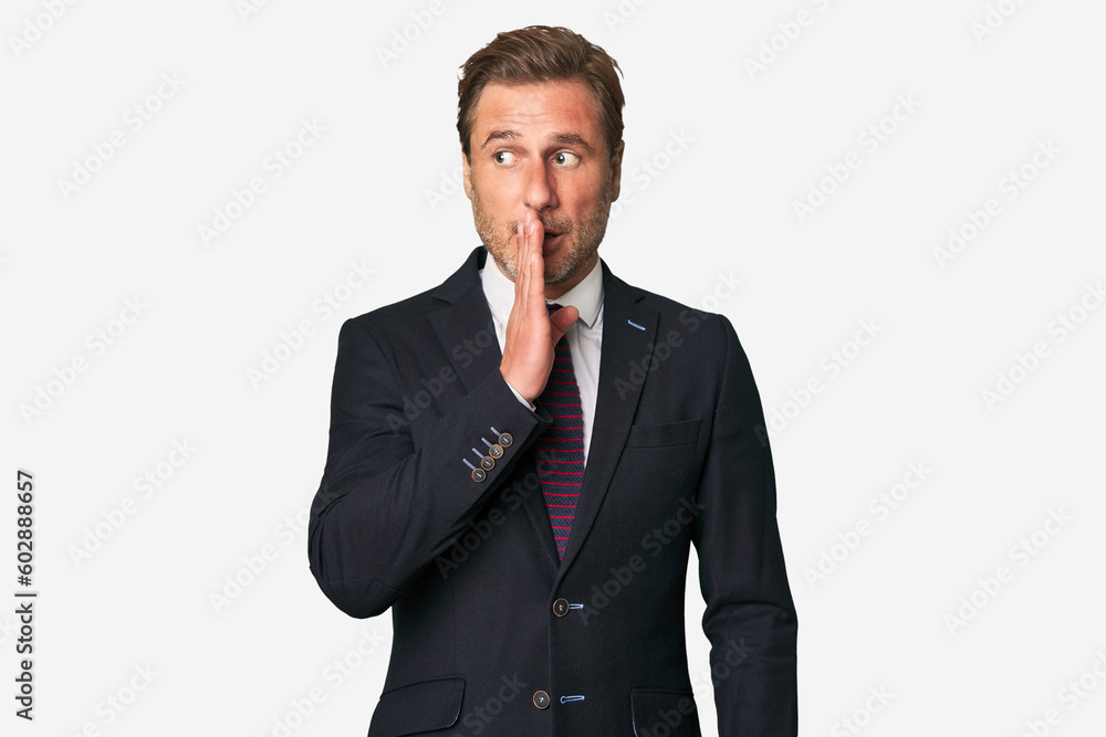 A middle-aged businessman isolated is saying a secret hot braking news and looking aside A middle-aged businessman isolated is saying a secret hot braking news and looking aside