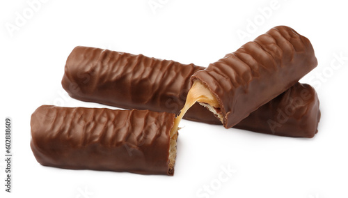 Sweet tasty chocolate bars with caramel on white background