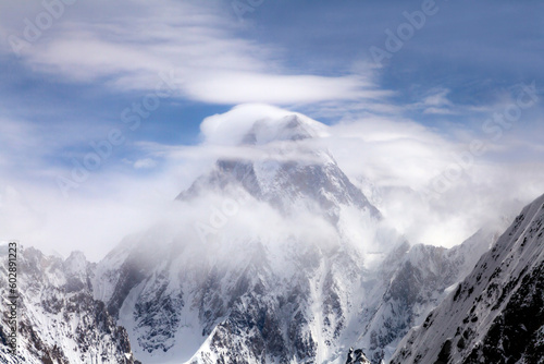 beautiful view og g 4 or gesherbrum 4 under the cluds in blue sky, Gasherbrum IV, surveyed as K3, is the 17th highest mountain on Earth and the 6th highest in Pakistan photo