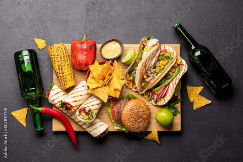 Mexican food featuring tacos, burritos, nachos, burgers