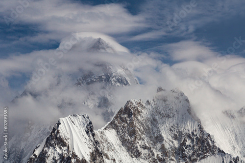 beautiful view og g 4 or gesherbrum 4 under the cluds in blue sky, Gasherbrum IV, surveyed as K3, is the 17th highest mountain on Earth and the 6th highest in Pakistan photo