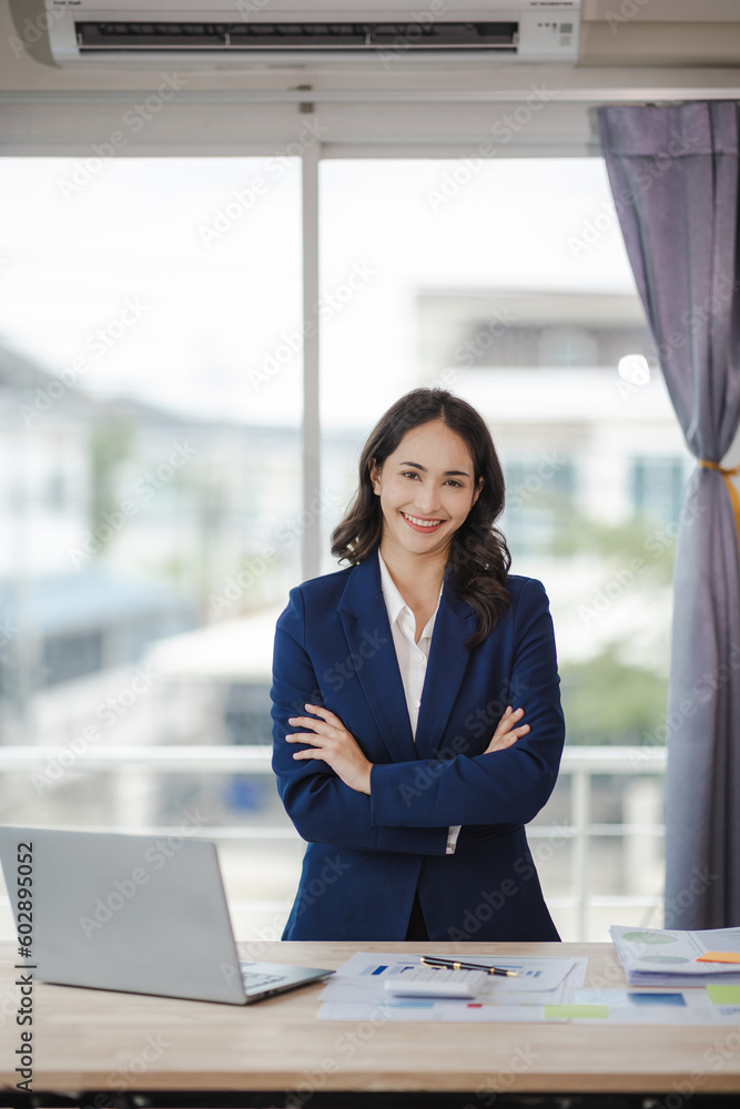 happy young woman excited at work Successful Asian businesswoman with laptop smartphone at work. happy young woman excited at work Successful Asian businesswoman with laptop smartphone at work.