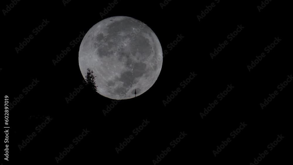 The full moon falls behind Phra That Doi Suthep. Chiang Mai Province, Thailand. The full moon falls behind Phra That Doi Suthep. Chiang Mai Province, Thailand.