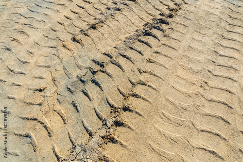 Impints of the truck tires on sand near quarry. Earthworks  offroad