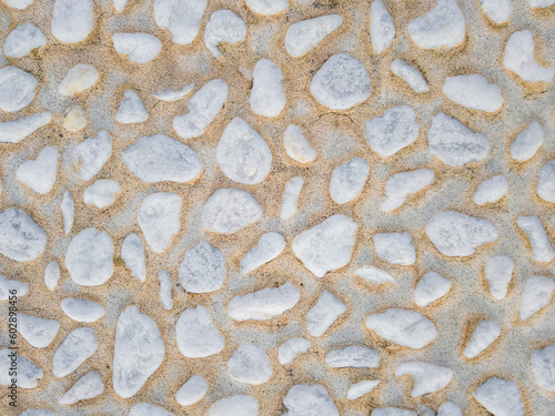 Vászonkép White pebblestone wall background