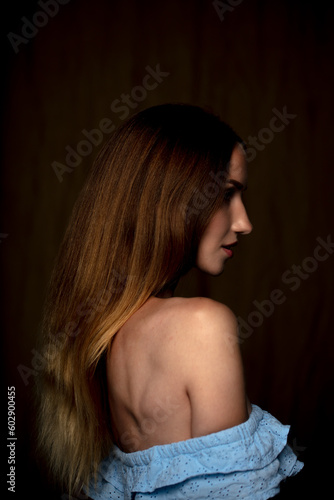 portrait of a young beautiful woman on a dark background