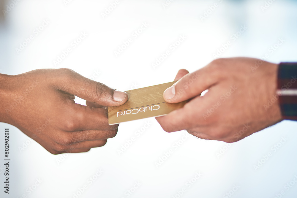 Hands, payment and finance with a card retail or shopping between a customer and teller in a store closeup. Money, sale and membership with a person spending their budget in a mall for consumerism Hands, payment and finance with a card retail or shopping between a customer and teller in a store closeup. Money, sale and membership with a person spending their budget in a mall for consumerism