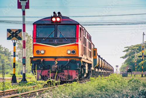 Locomotive with Tanker-freight train on the railway, Thailand.
