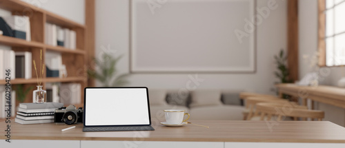 A tablet mockup and copy space on wooden tabletop in cozy minimal living room.