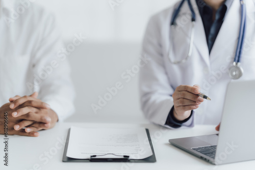 Close up view of professional physician consulting with male patient  talking to male client at medical checkup visit