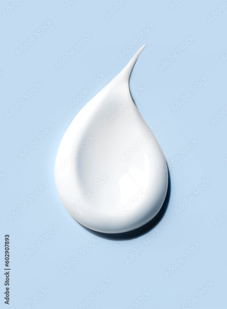 cosmetic smears of creamy texture on blue background cosmetic smears of creamy texture on blue background