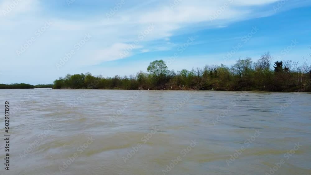 Batumi, Georgia – April 9, 2023: Muddy Chorochi river. It looks like this because of spring snow melting high in mountains. Fast muddy river drone pan left from
riverside Batumi, Georgia – April 9, 2023: Muddy Chorochi river. It looks like this because of spring snow melting high in mountains. Fast muddy river drone pan left from
riverside