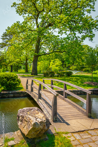 Japanese Garden at Roger Williams Park, Providence, Rhode Island, a footbridge over the pond, and green trees on the island