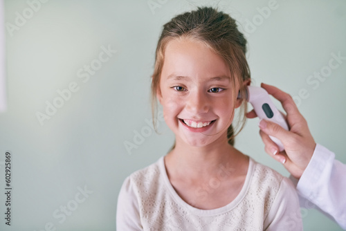 Billede på lærred Healthcare, children and a girl at the pediatrician for a temperature checkup or appointment in the hospital