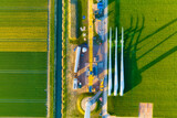 Construction and installation of a wind turbine. Production of clean green energy. Technology and innovation. Aerial view. Industrial landscape from a drone. Top view.