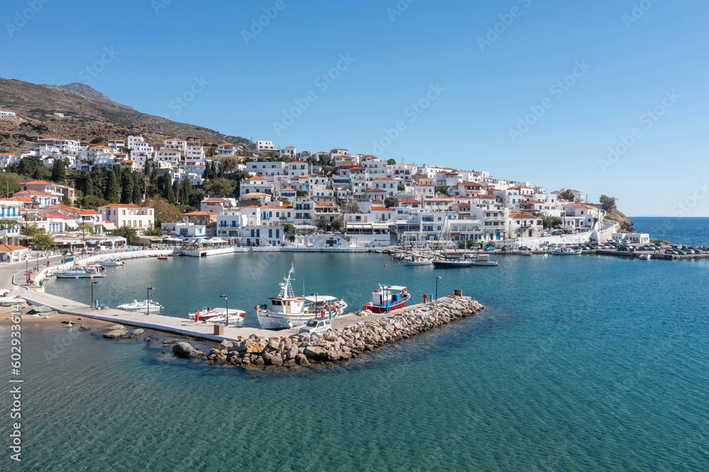 Andros island, Batsi village, Cyclades Greece. View of traditional building, port, sea, blue sky.