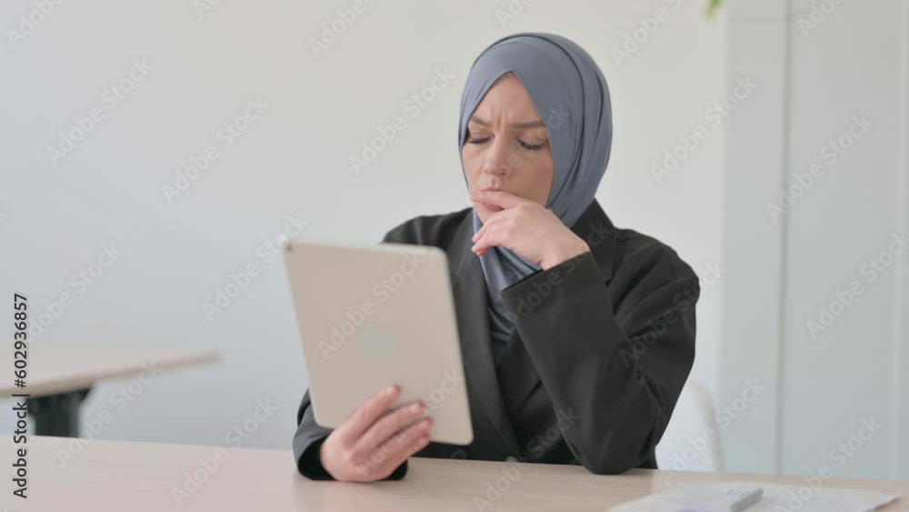 Arab Businesswoman Upset by Loss on Tablet Arab Businesswoman Upset by Loss on Tablet