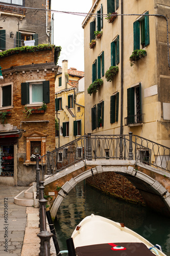 Narrow canals of Venice city with old traditional architecture, bridges and boats, Veneto, Italy. Tourism concept. Architecture and landmark of Venice. Cozy cityscape of Venice. © Lizaveta