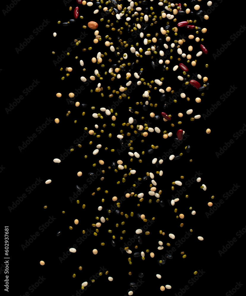 Mix beans fall down explosion, several multi kind bean float explode. Dried mixed white green red soy black peanut beans splash throwing in Air. Black background Isolated Mix beans fall down explosion, several multi kind bean float explode. Dried mixed white green red soy black peanut beans splash throwing in Air. Black background Isolated