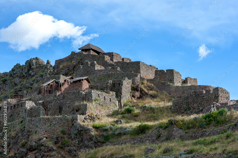 The ancient ruins of Pisac in the Sacred Valley in Peru in the late afternoon. Pisac is best known for these Incan ruins, known as Inca Pisac, which lie atop a hill at the entrance to the valley. 