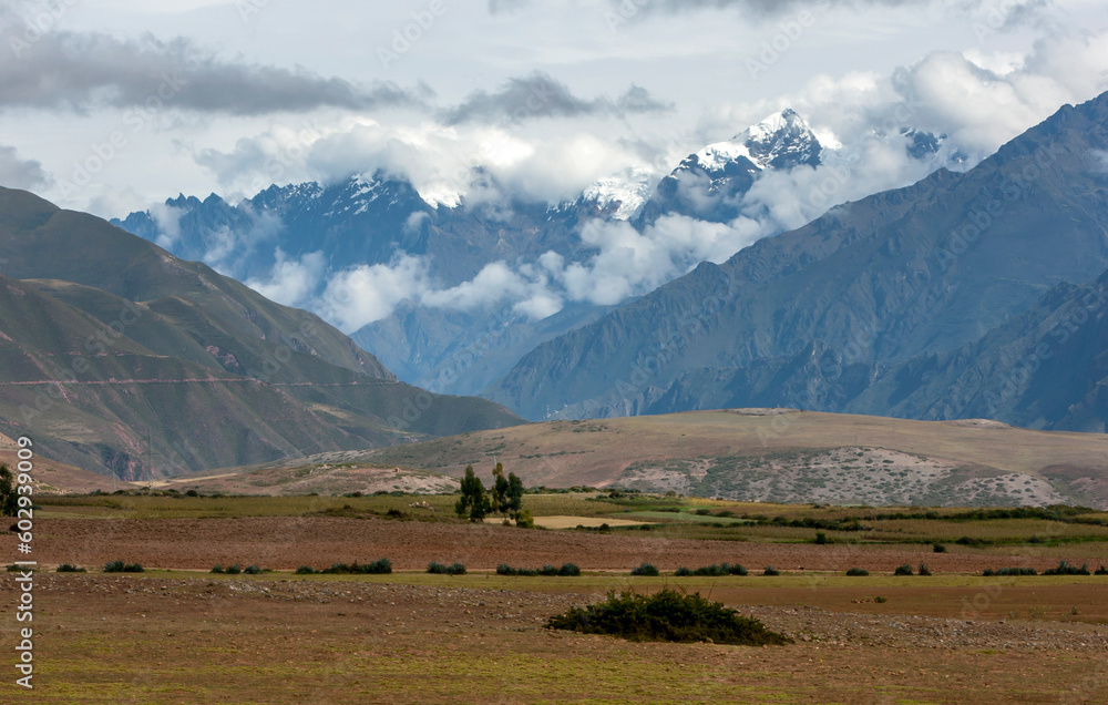 A view of the snow capped Andes Mountain range as seen from the farming land near Maras in Peru. Maras is a town in the Sacred Valley of the Incas, 40 kilometers north of Cusco.
